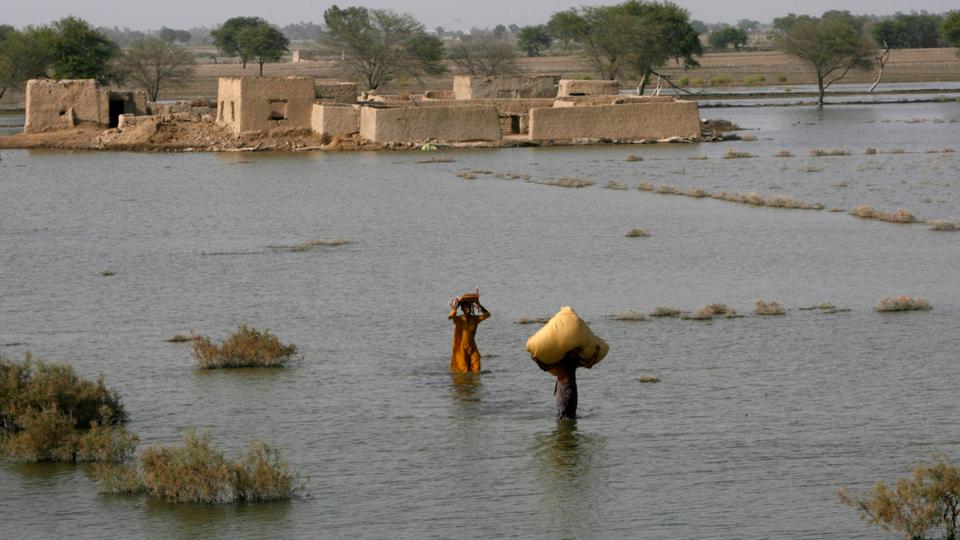 This photo from the 2010 floods in Pakistan shows waters rising in villages surrounding Manchar Lake, which had swollen because of flood waters, in Dadu in Pakistan's Sindh province.