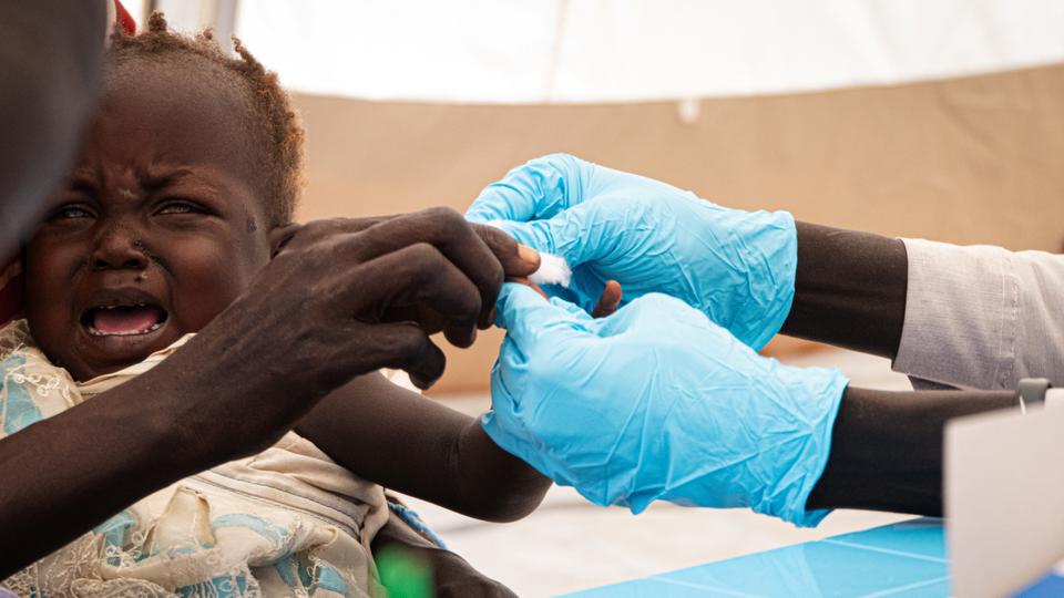 A child reacts as she is screened for the malaria disease in Bentiu, Unity State, as seen in this image taken by Doctors Without Borders. (File)