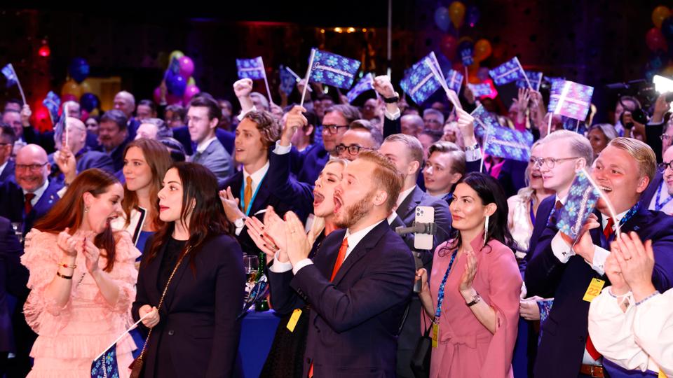 Supporters of the Sweden Democrats react on the results of the exit polls at the party's election watch in Nacka, near Stockholm.