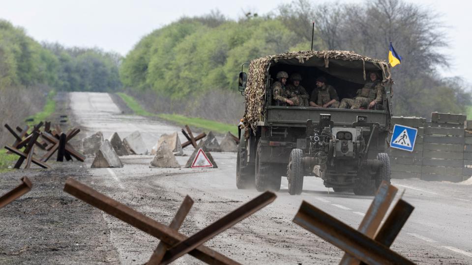 A Ukrainian military vehicle drives to the front line during a fight, amid Russia's attack on Ukraine, near Izyum, Kharkiv region, Ukraine, April 23, 2022.