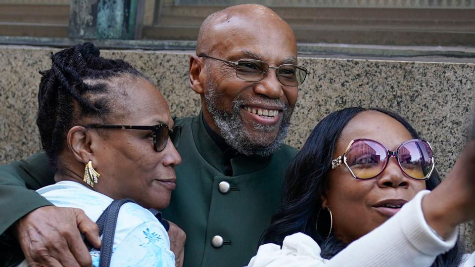 Muhammad Aziz, centre, stands outside the courthouse with members of his family after his conviction in the killing of Malcolm X was vacated in New York.