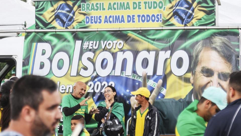 Supporters of President Jair Bolsonaro, mainly truck drivers, block the BR-101 highway in Palhoca, in the metropolitan region of Florianopolis, Santa Catarina State, Brazil, on October 31, 2022, as an apparent protest over Bolsonaro's defeat in the presidential run-off election.