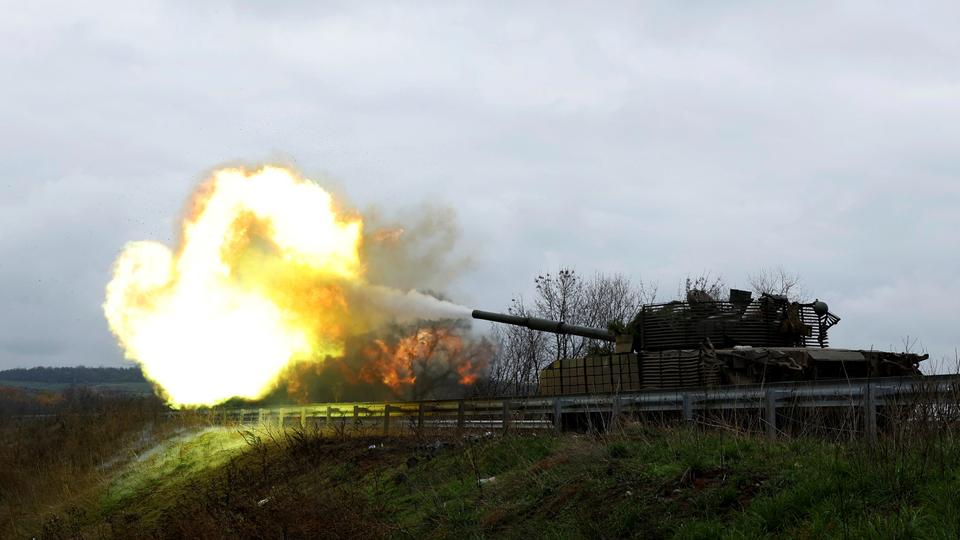 Ukrainian soldiers fire a round on the frontline from a T80 tank that was captured from Russians, in the eastern Donbas region of Bakhmut.