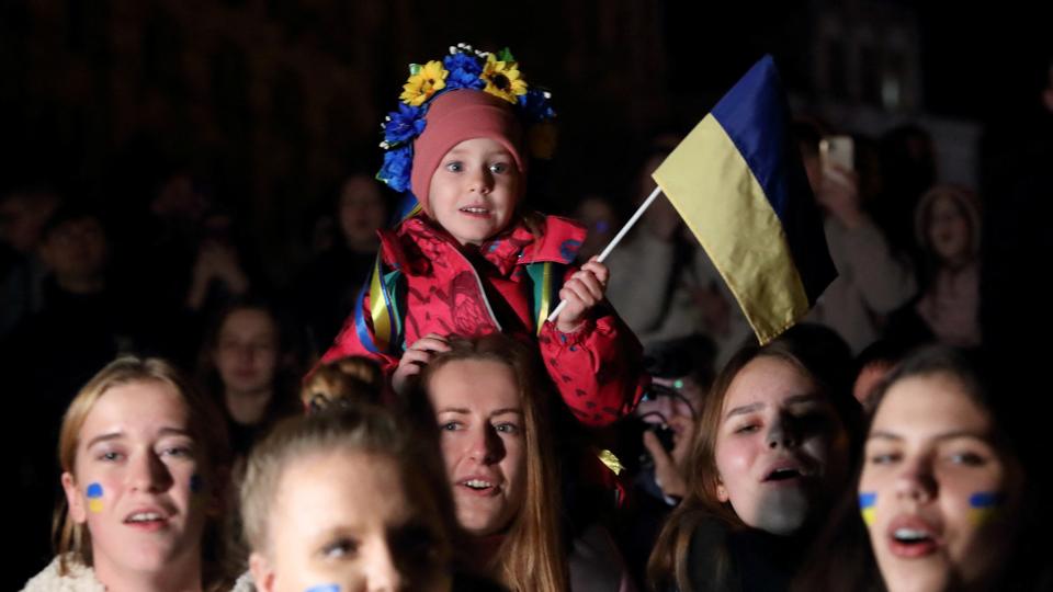 People celebrate after Russia's retreat from Kherson, in central Kiev, Ukraine on November 11, 2022.