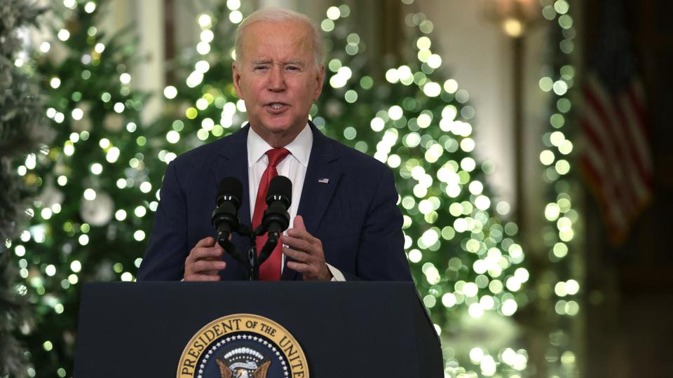 US President Joe Biden speaks as he delivers a Christmas address in the East Room of the White House.