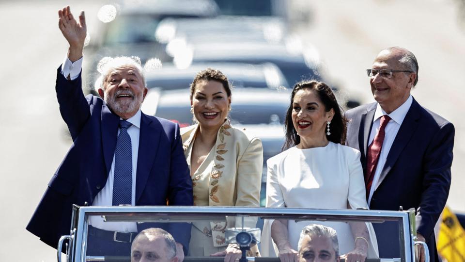 Brazil's President elect Luiz Inacio Lula da Silva waves to supporters on the day of his swearing-in ceremony.