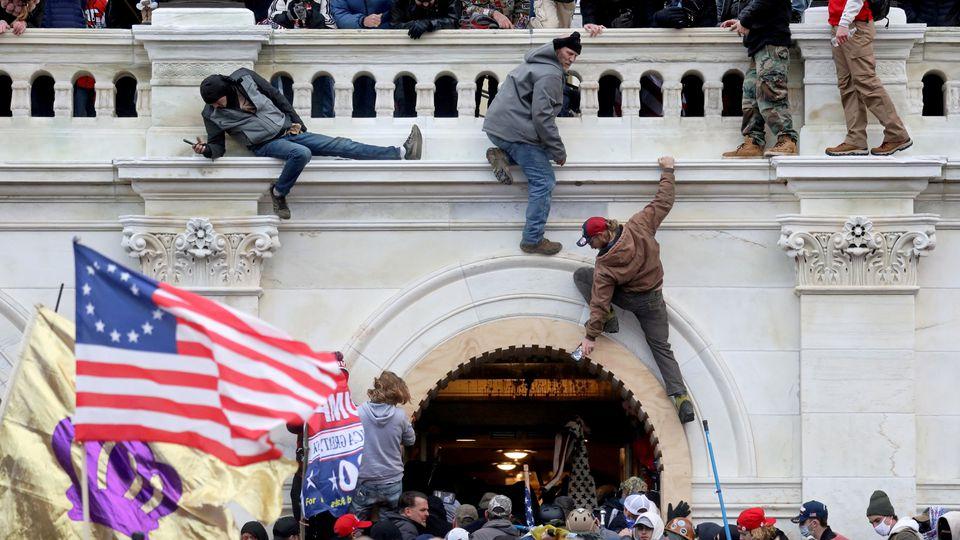 More than 2,000 rioters entered the US Capitol building, many of whom occupied, vandalised, looted and assaulted police officers and reporters; and attempted to locate lawmakers to capture them.