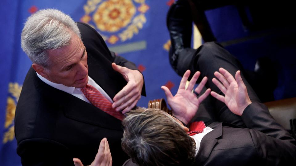 House Republican Leader Kevin McCarthy (R-CA) speaks to U.S. Rep. Andy Ogles (R-TN) during voting for a new speaker on the third day of the 118th Congress.