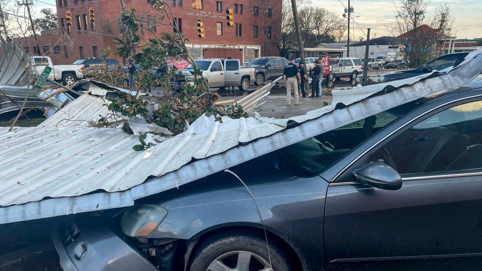 A damaged vehicle and debris are seen in the aftermath of severe weather in Selma city in Alabama.