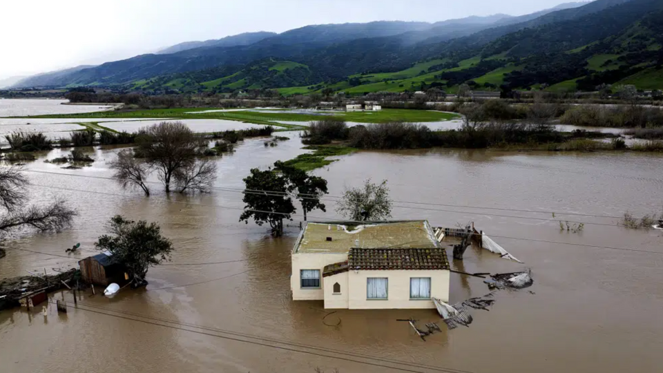 Floodwaters cover South Davis Road.  near Salinas in Monterey County and the Salinas River in California overflowing its banks.
