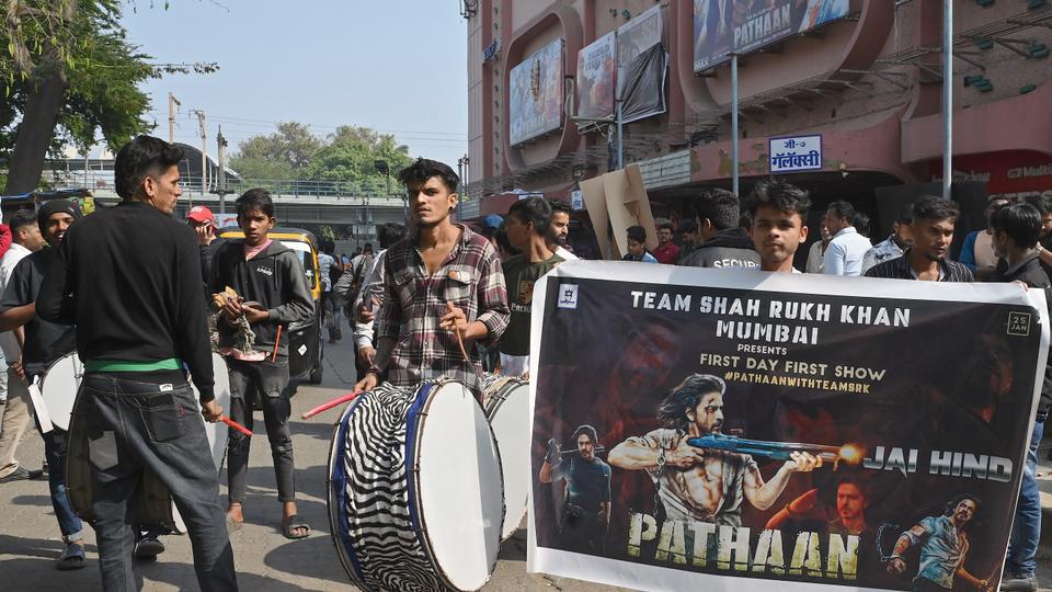 Fans of Bollywood actor Shah Rukh Khan gathered in front of a movie theater in Mumbai to watch the movie 'Pathaan'.