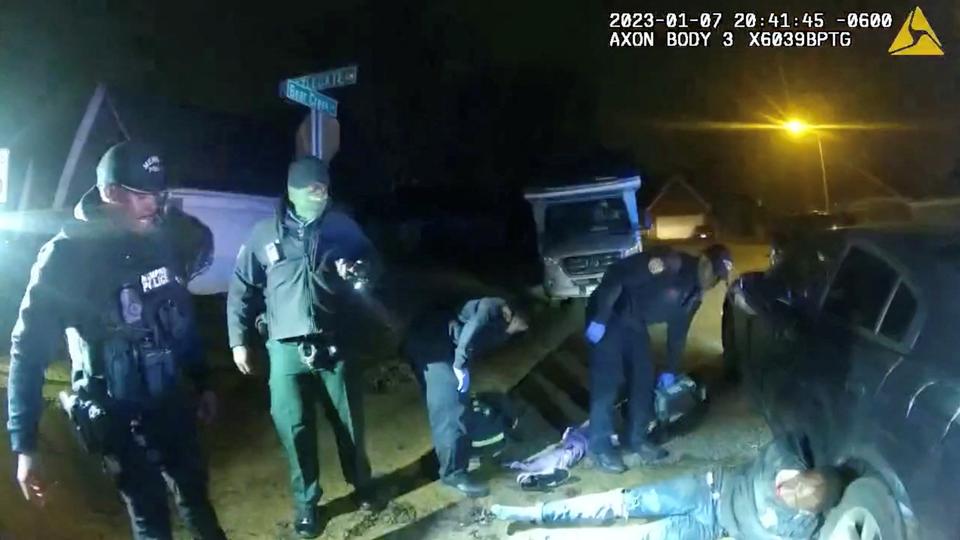 Police officers look at Tyre Nichols after being beaten by Memphis Police Department officers on January 7, 2023.