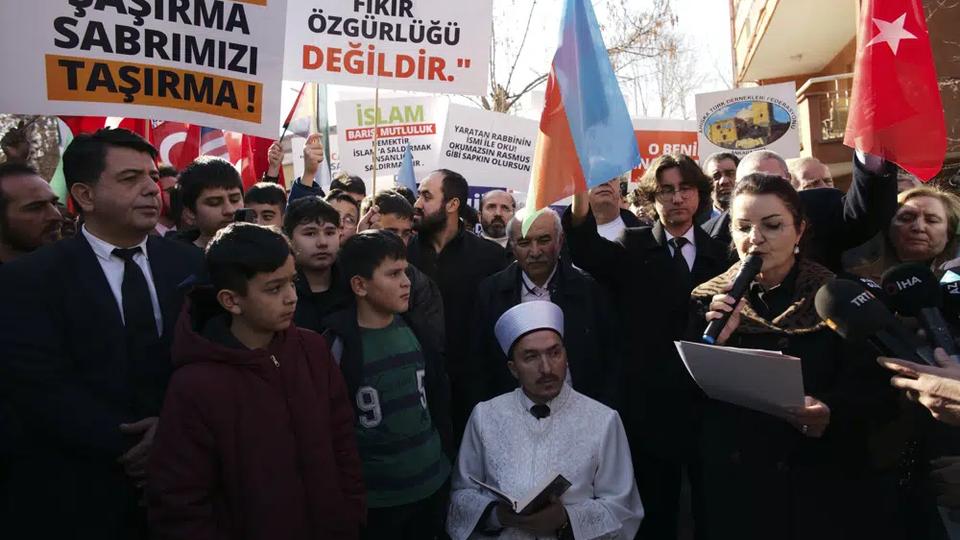 An Imam recites from the Quran during a demonstration outside the Swedish embassy in Ankara.