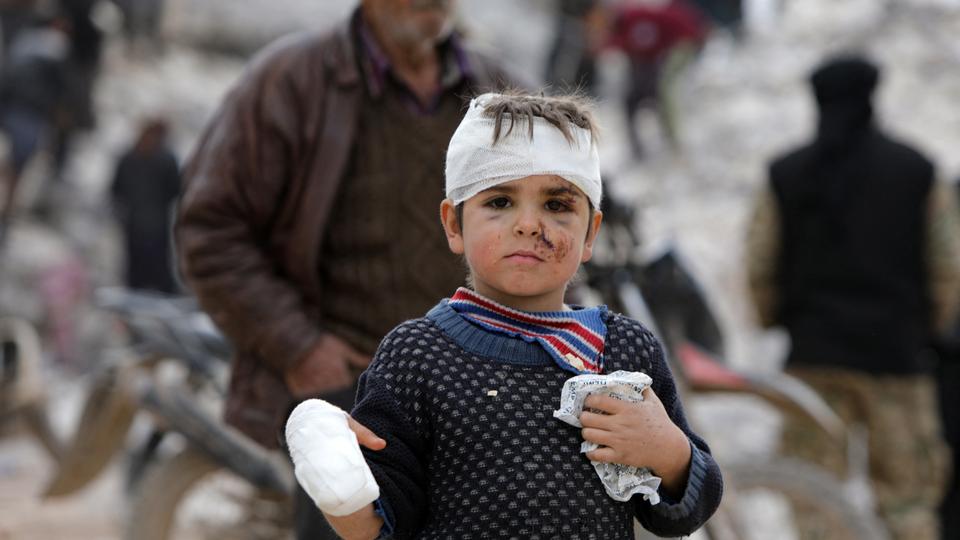 Musa Hmeidi, 6, who was pulled out alive from rubble of a collapsed building on February 10, is pictured hours after he was rescued in opposition-run town of Jindayris.