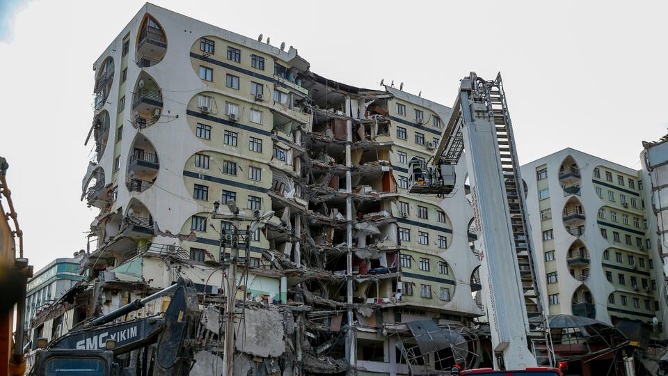 Demolishment of a damaged building stops after a cat is detected inside the building in quake-hit Diyarbakir province on February 22, 2023.