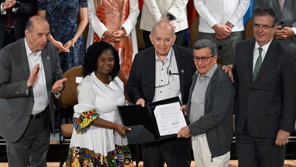 Delegates pose for a picture during the closing of the second round of talks in Mexico.