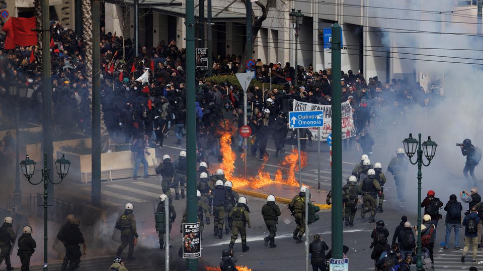 Police fired tear gas and stun grenades as demonstrators tried to surround them, hurling firebombs and rocks.