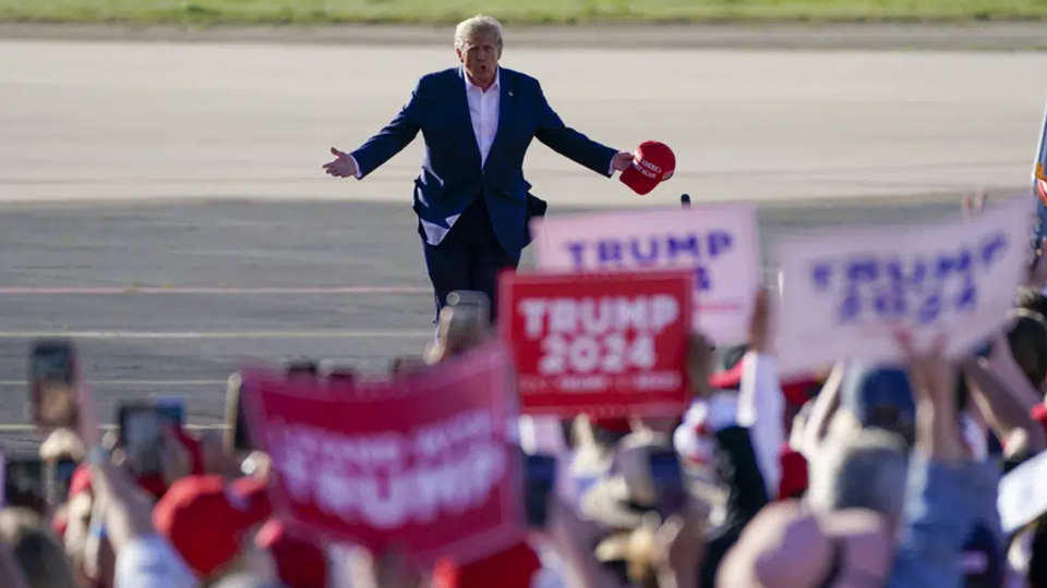 Donald Trump walks across the tarmac as he arrives to speak at a campaign rally at Waco Regional Airport in Waco, Texas.