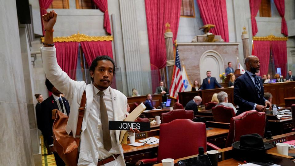 Justin Jones carries his name tag after a vote at the Tennessee House of Representatives to expel him for his role in a gun control demonstration at the statehouse last week, in Nashville.