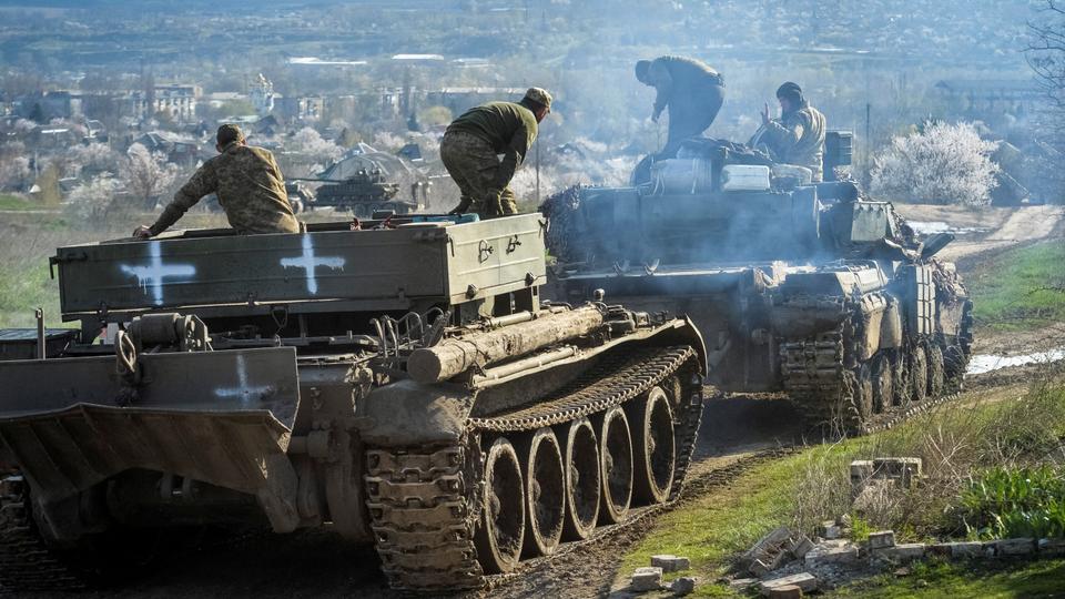 Ukrainian service members ride tanks, as Russia's attack on Ukraine continues, near the front line city of Chasiv Yar, in Ukraine.
