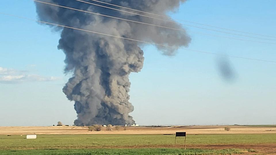 This image obtained from the Facebook page of Castro County Sheriff's Office shows a plume of smoke rising from the Southfork Dairy Farms.