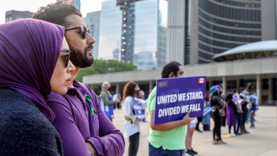 Residents in Toronto attend a rally sponsored by the Muslim Association of Canada to highlight anti-Muslim hate crimes in their communities and in other parts of the world.