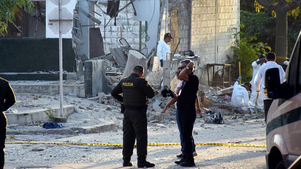 Police officers near the site of a bomb attack at a police station in Barranquilla, Colombia, January 28, 2018.