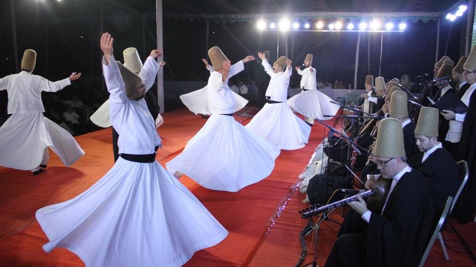 Turkish whirling dervishes perform during the traditional ceremony of Sufi whirling dervishes at the Dhaka Shilpakala Academy in Dhaka, Bangladesh on February 24, 2018.