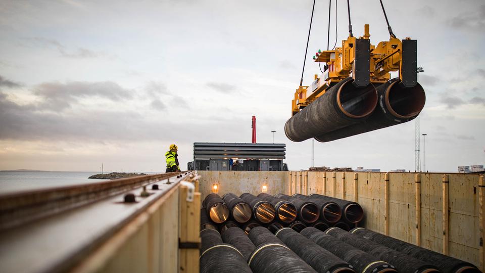 Pipes are loaded onto a vessel in the northern port of Mukran, on the island of Ruegen, Germany, on February 28, 2018.