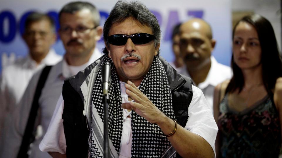 In this March 11, 2013 file photo, Jesus Santrich, member of the negotiating team for Colombia's Revolutionary Armed Forces of Colombia (FARC), speaks to journalists at the continuation of peace talks with Colombia's government in Havana, Cuba.