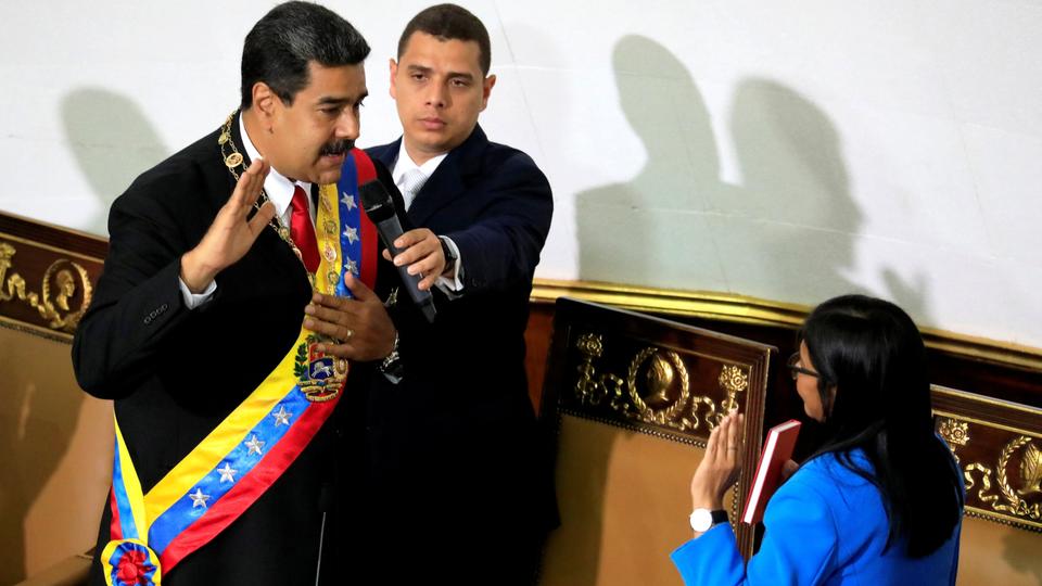 Venezuela's President Nicolas Maduro takes the oath as re-elected President by the National Constituent Assembly President Delcy Rodriguez during a special session of the National Constituent Assembly at the Palacio Federal Legislativo in Caracas.