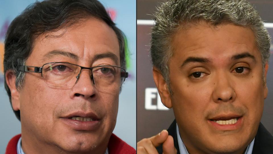This combination of pictures created on May 27, 2018 shows Colombian presidential candidate Gustavo Petro for the Colombia Humana party (L) and presidential candidate for the Democratic Centre party Ivan Duque, in Bogota.