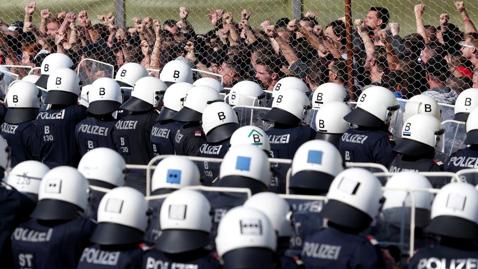 Policemen attend an exercise to prevent migrants from crossing the Austrian border from Slovenia in Spielfeld, Austria on June 26, 2018.