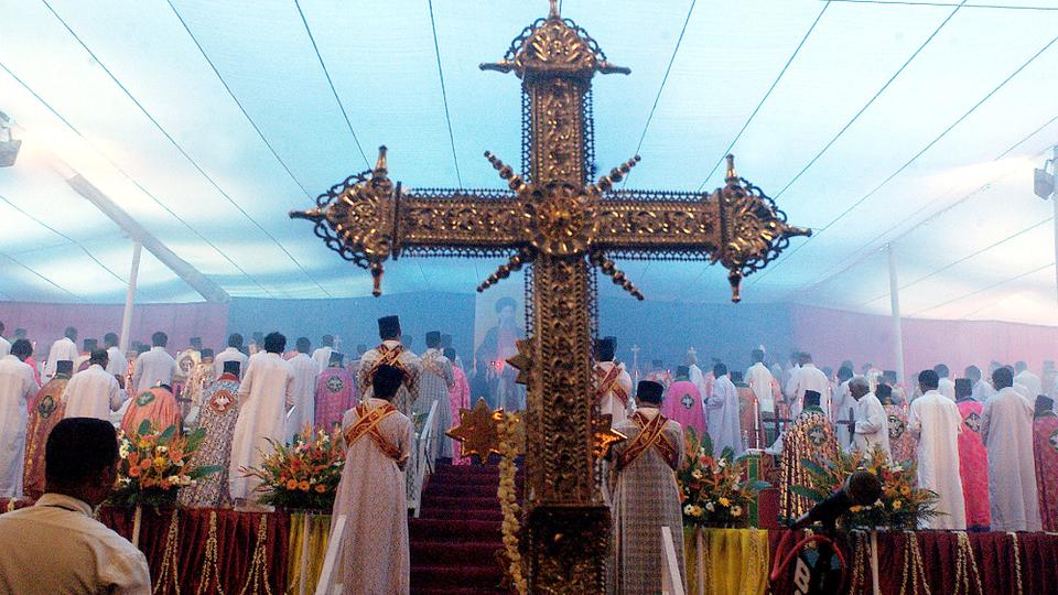 101 priests of the Jacobite Syrian Orthodox Church perform Mass simultaneously at Puthencruz, 24 kilometres (15 miles) from Cochin, southern India to commemorate the death centenary of St Gregorious.  November 2, 2002.
