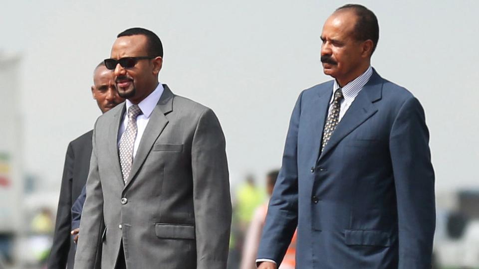 Eritrea's President Isaias Afwerki (R) is welcomed by Ethiopian Prime Minister Abiy Ahmed upon arriving for a three-day visit, at the Bole international airport in Addis Ababa, Ethiopia on July 14, 2018.