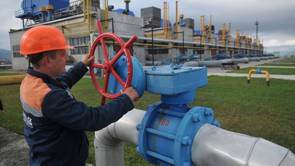 In this Oct. 7, 2015 file photo, a worker at a Ukrainian gas station Volovets in western Ukraine controls a valve.