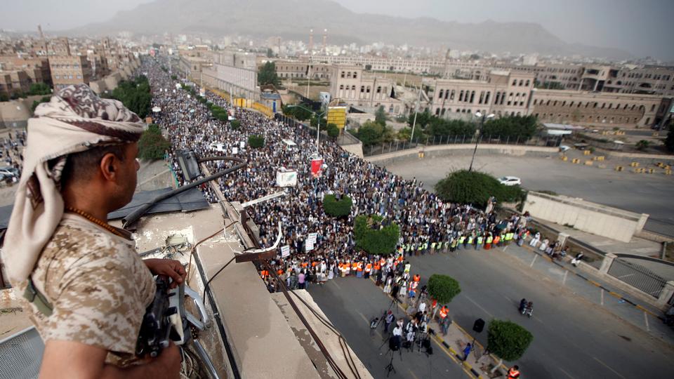 A Houthi fighter secures a rally to denounce the Saudi-led coalition's offensive on the Red Sea coast areas, in Sanaa, Yemen on June 29, 2018.