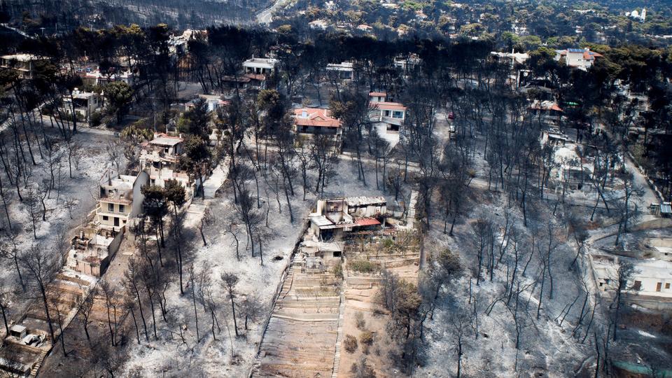 An aerial view shows burnt houses and trees following a wildfire in the village of Mati, near Athens, Greece, July 25, 2018.