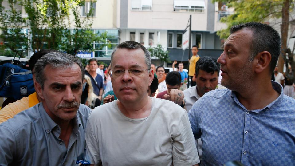 American Pastor Andrew Craig Brunson (C), who was charged with committing crimes, including spying for the PKK terror group and the Fetullah Terrorist Organisation, arrives at the address, where he was put under house arrest due to his health problems, in Izmir, Turkey on July 25, 2018.