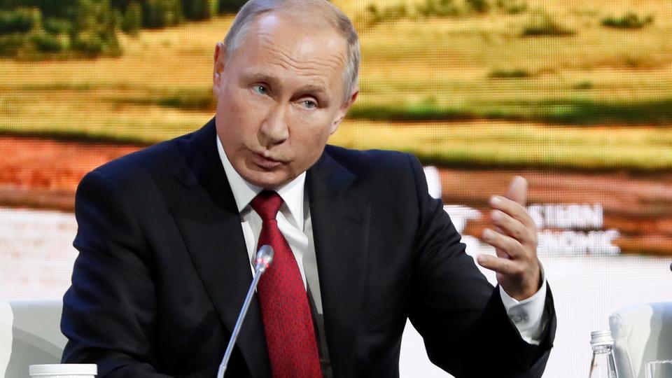 Russian President Vladimir Putin gestures as he speaks during a plenary session at the Eastern Economic Forum in Vladivostok, Russia, Wednesday, Sept. 12, 2018. Putin says Russia has identified the two men that Britain named as suspects in the poisoning of a former Russian spy and that there was 