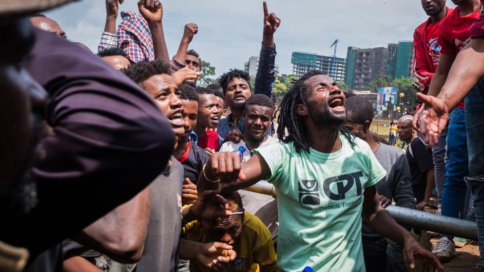 People react at Meskel Square in Addis Ababa, Ethiopia, to protest on September 17, 2018 against the killing of 23 people and displacement of residents in Burayu town over the weekend.