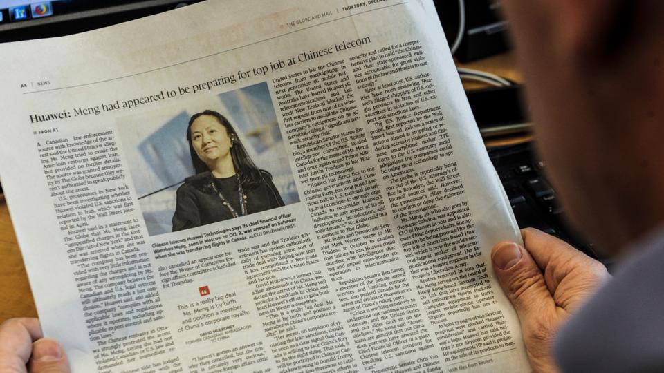 An illustration shows a journalist reading a news page about tech giant Huawei in The Globe and Mail in Montreal, Canada, December 6, 2018.