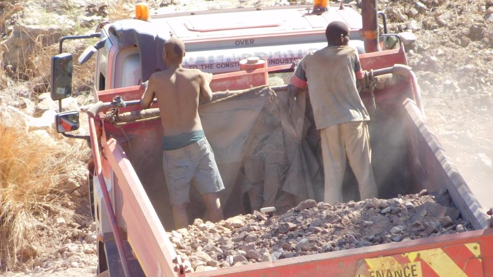 A lorry carries gold ore from the pit at Gaika Mine to a mill for processing.