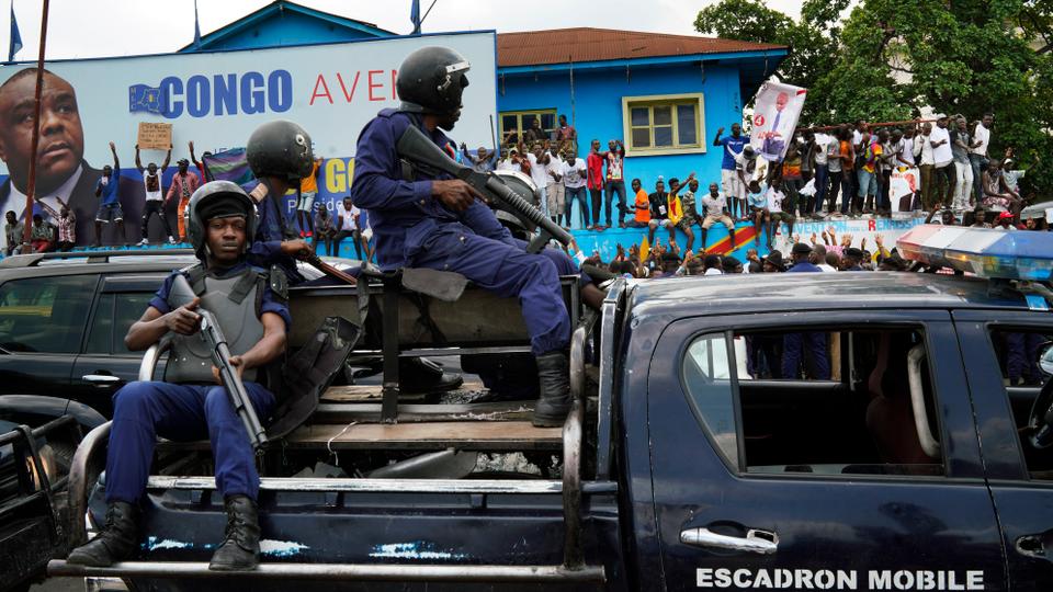 Police take position outside the headquarters of Jean Pierre Bemba's MDC party where DRC opposition candidate Martin Fayulu addressed supporters in Kinshasha, January 11, 2019.