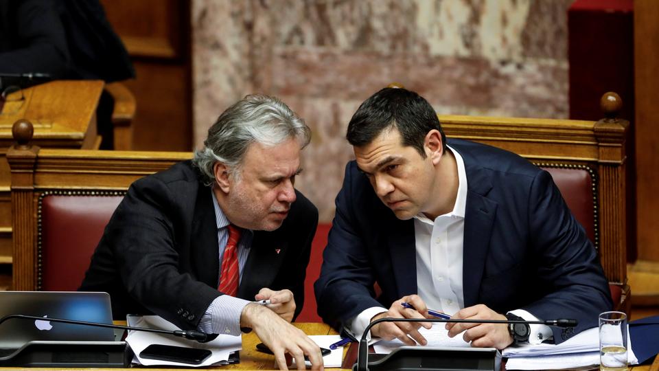 Greek Prime Minister Alexis Tsipras and Alternate Minister of Foreign Affairs George Katrougalos discuss during a parliamentary session before a vote on an accord between Greece and Macedonia changing the former Yugoslav republic's name in Athens, Greece, January 24, 2019.