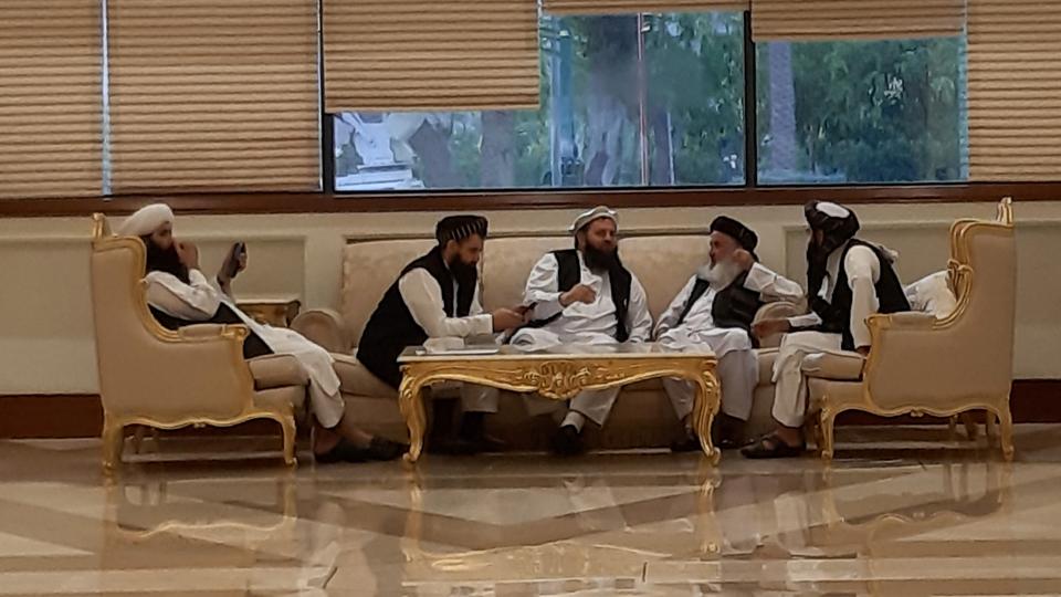 Members of Afghan delegations talk during the second day of Intra-Afghan conference for peace in Doha, Qatar on July 8, 2019.