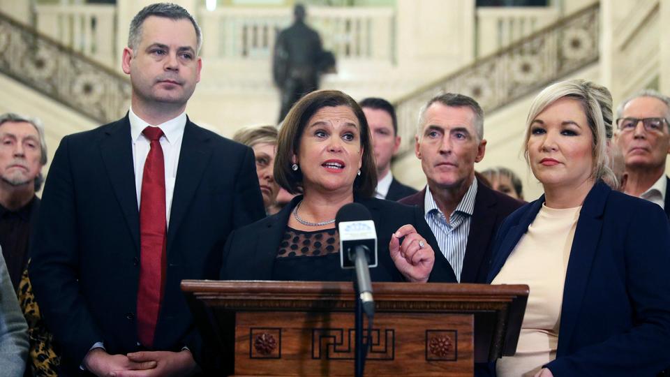 Sinn Fein leader Mary Lou McDonald, center, and deputy leader Michelle O'Neill, right, with party colleagues speak to the media in the Great Hall of Parliament Buildings, Stormont, in Belfast, Friday, January 10, 2020.