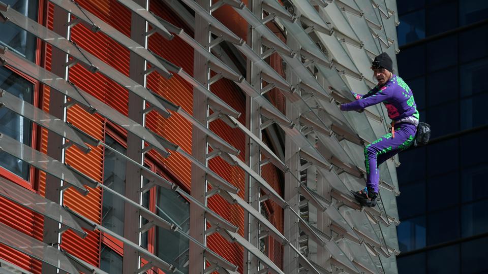 French 'Spiderman' climbs Barcelona skyscraper to protest virus panic