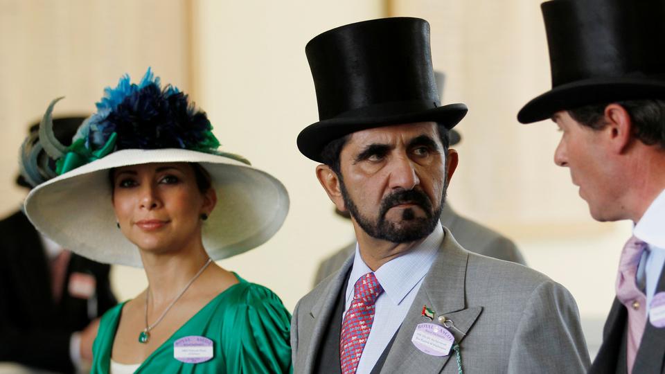 Princess Haya bint Al Hussein and Sheikh Mohammed bin Rashid al Maktoum (C), walk to parade ring on Ladies Day, third day of horse racing at Royal Ascot in England on June 17, 2010. [File]