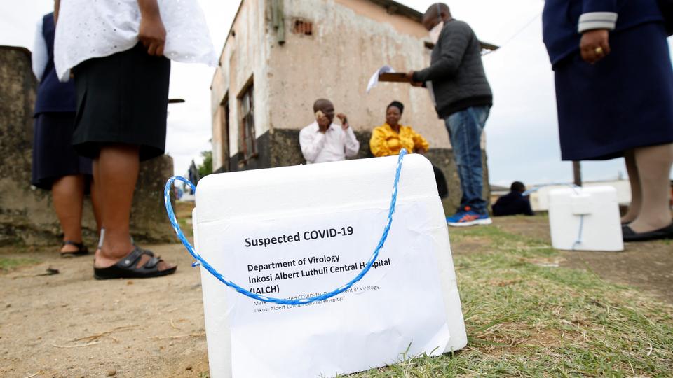 Health workers speak to residents during a door-to-door testing in an attempt to contain the coronavirus disease (COVID-19) outbreak, in Umlazi township near Durban, South Africa, April 4, 2020